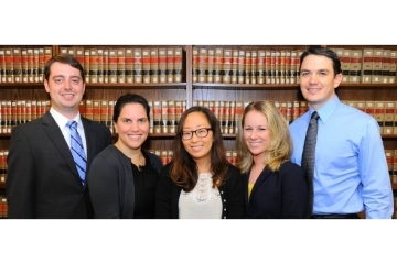5 students standing infront of library