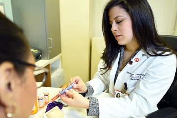 Melissa Favale-O'Brien handling pharmacy materials