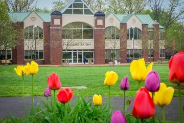 Staten Island Campus in the background with Tulips