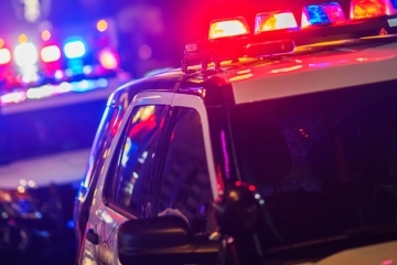 Police cars with sirens on