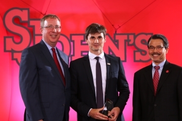 Mike Cragg, Andrei Crapcenco, President Gempesaw posing on stage