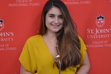 Abigail Dell’Orto holding award