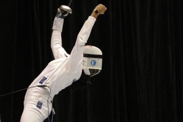 Iris Washington throwing her hands up celebrating