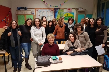 SOE people pose for a picture in a classroom