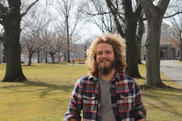 Cole Sagan pictured on the Great Lawn of Queens Campus
