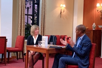 Alumna author Joyce Montalbano, Ed.D. '69Ed speaks with fellow alumnus Reginald Landeau Jr. '12Ed.D.