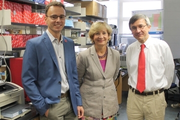 Professors Ruggiu, Vancurova, and Vancura standing in a lab