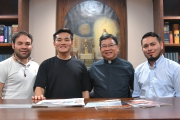 Rev. Michael M. Nguyen, C.M. with 3 other priests posting for a photo