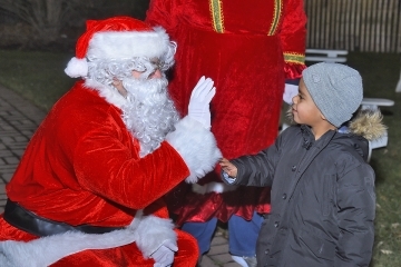Santa high-fives child
