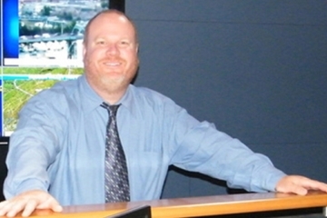 Peter Shields in front of some monitors
