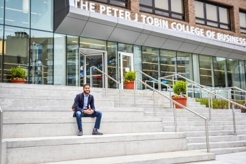 Guy sitting on steps of tobin