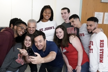 Jimmy Fallon taking a selfie with St. John's University students in dorm room