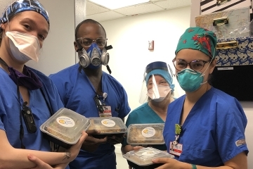 Healthcare workers receiving food that was donated