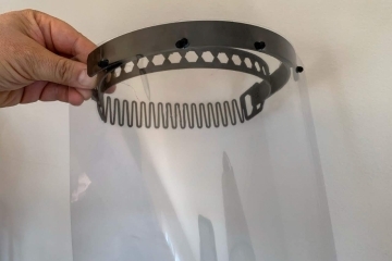 Face shield being held up