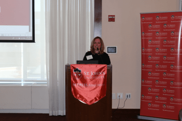 Susan Damiani speaking at podium