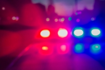 police car lights blurred in red white and blue