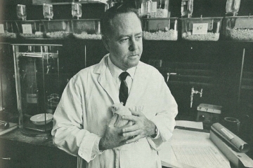 dr_vincent_de_paul_lynch_tox_prog_founder_sju_alumni in lab coat