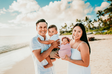 Allie Aoanan-Talavera and her husband with their two kids on the beach