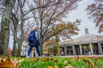 Students walking into church in the fall