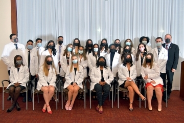 Radiologic Sciences White Coat Ceremony students seated for photo