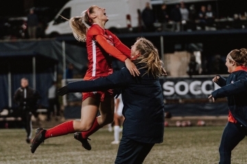 Female Soccer Players Celebrating on Field