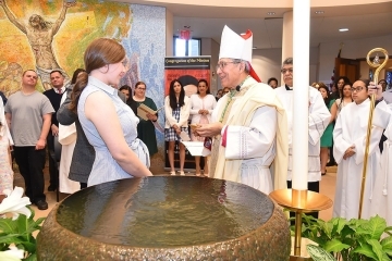 Alicia Venter in St. Thomas More Church with Bishop