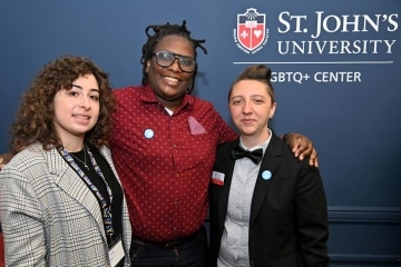 Dr. Smalls, Dr. Roberts and other person pose for a photo