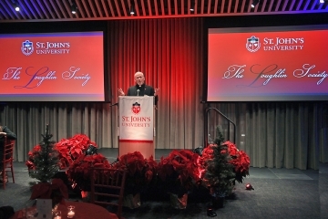 Speaker at podium at Loughlin Society Winter Reception 