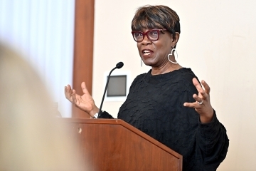 Patricia Smith speaking at the podium