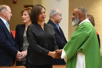 Couple holding hands in church