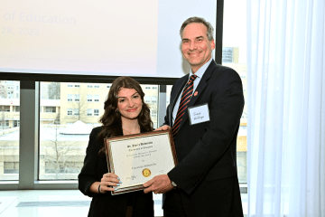 Dean presenting award to Carmela Abbatiello