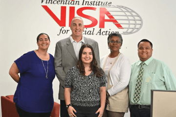 Gabriella Aordkian with VISA employees