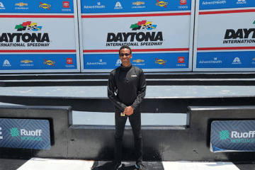 Phillip Hall at NASCAR event posing for a photo