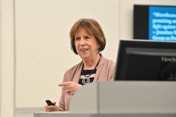Linda Sama talking in a classroom