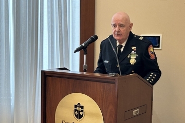 Capt. Timothy Jaccard speaking at podium