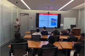 dr._bernard_jones_engages_with_the_young_students_during_his_presentation