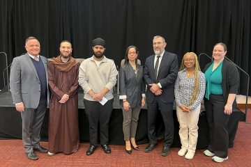 Panel speakers posing for photo