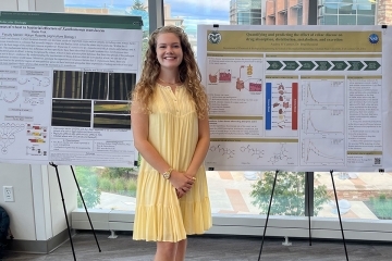 Audrey O'Connor standing in front of research poster