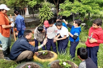 Plunge participant during an activity interacting with children