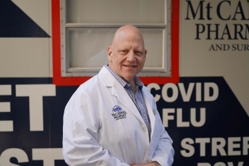 St. John’s Alumnus Roger Paganelli, R.Ph. ’87P standing outside of the Mt. Carmel Pharmacy.