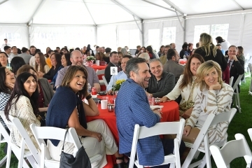 Table of Staten Island Closing Celebration attendees smiling and laughing