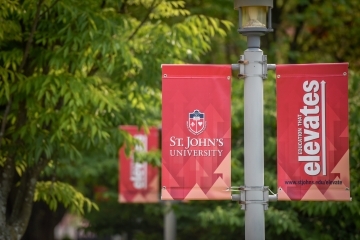 St. John's Education that Elevates lamplight banners
