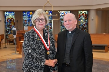 Mary Carole Schafenberg and Fr. Shanley at the 2022 Alumni Convocation