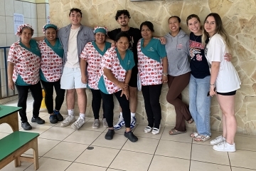 Ozanam Scholars pose for a photo with locals on Costa Rica Mission Trip