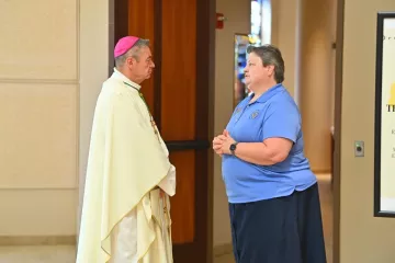 Sr. Pat speaking with Priest