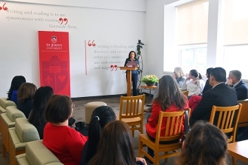 Woman speaking at podium at 2025 Values and Inclusion Program Reception