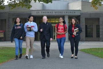 Father Shanley walking with students