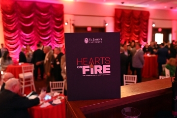 Hearts on Fire campaign sign against dimly lit ballroom