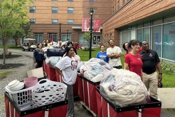 St. John's community members packing up bins with donations