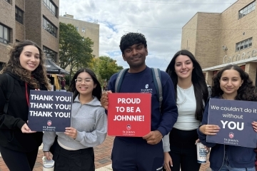 St. John's students holding Thank You signs for donors